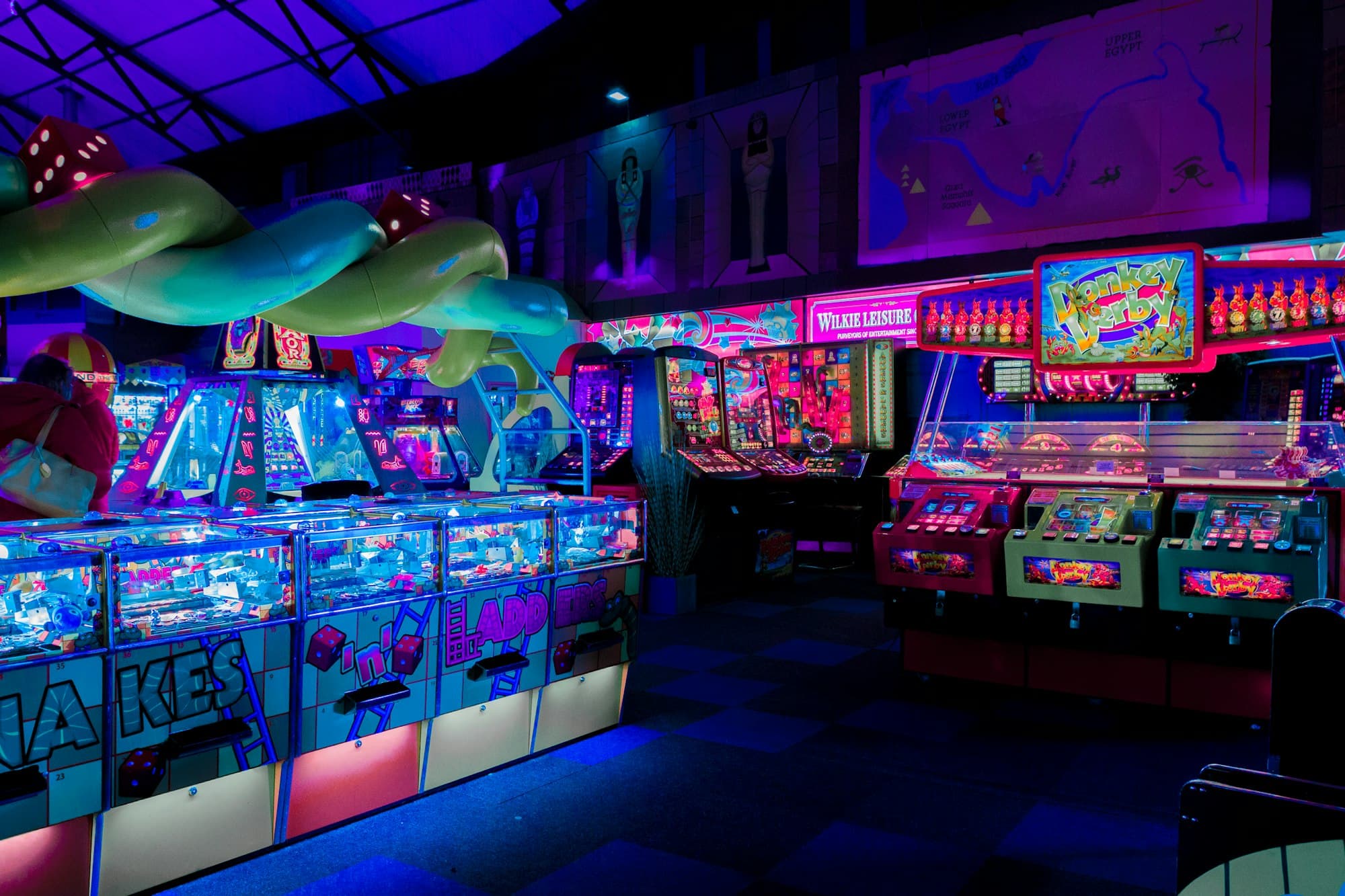 Busy arcade floor with games and lights