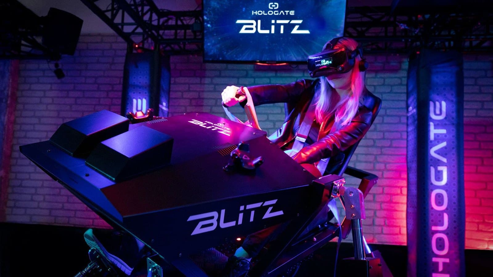 Player in a HOLOGATE Blitz motion seat wearing a VR headset