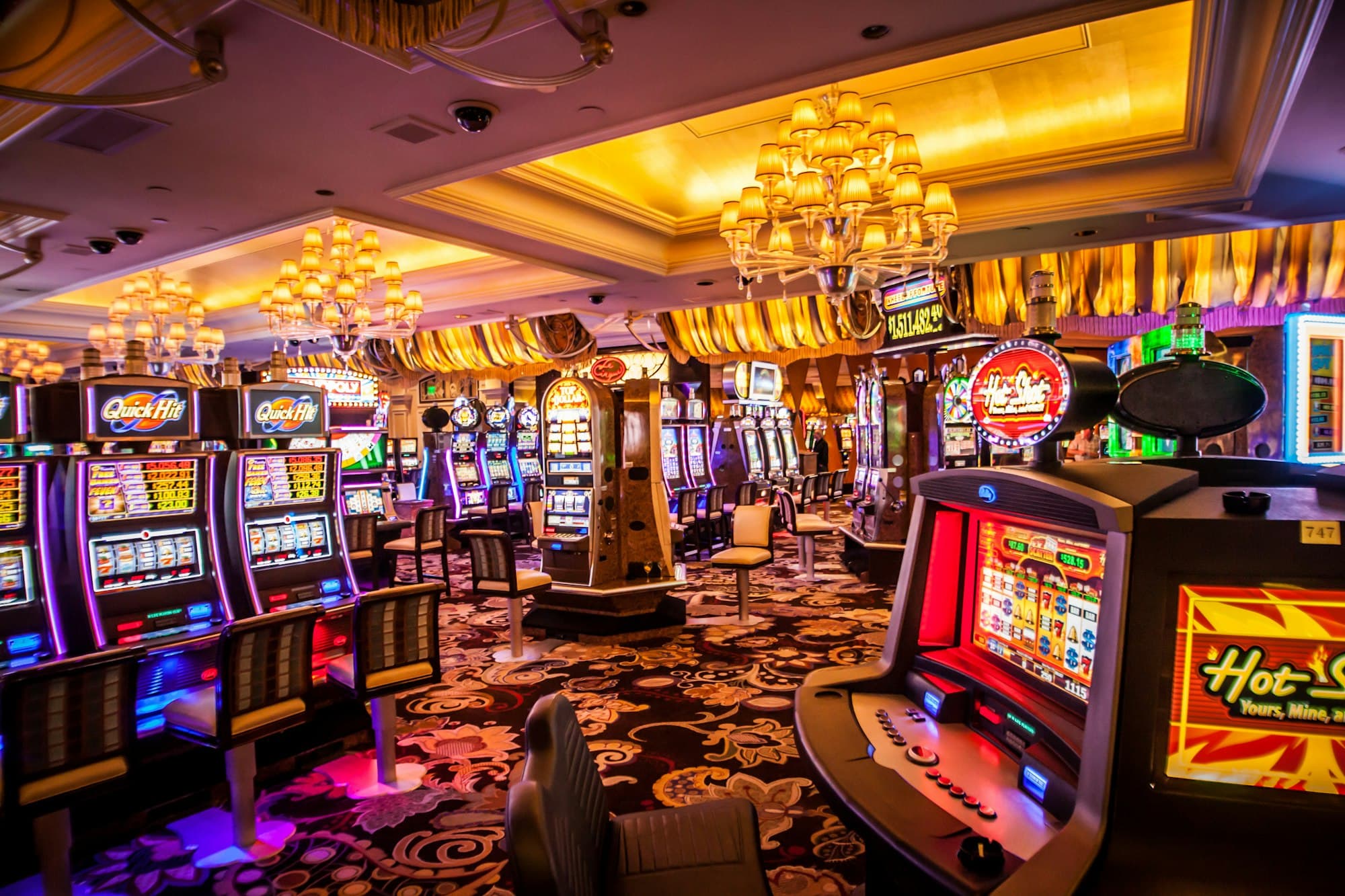Casino Machines gaming floor with illuminated cabinets